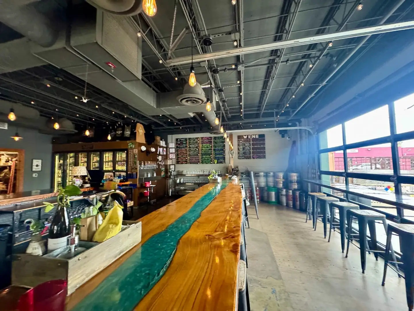 The Theodore’s wooden bar and colorful taproom interior